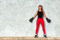 Beautiful young girl boxing gloves near the wall. Close-up copy space. Royalty Free Stock Photo