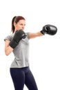Beautiful young girl with boxing gloves punching Royalty Free Stock Photo