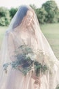 Beautiful young girl bride in a beautiful airy dress in beige colors , wedding in the style of boho