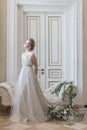 Beautiful young girl bride in a beautiful airy dress in beige colors , wedding in the style of boho