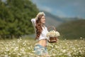 Beautiful young girl in chamomile field. Carefree happy brunette Royalty Free Stock Photo