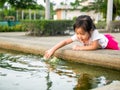 Beautiful young girl child fing something Royalty Free Stock Photo