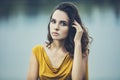 Beautiful young girl closeup portrait on the background of water Royalty Free Stock Photo