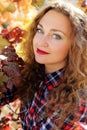 Beautiful young girl in colorful grape vineyard Royalty Free Stock Photo