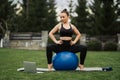 Beautiful young girl doing exercises with fit ball Royalty Free Stock Photo