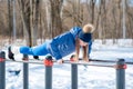 Beautiful young girl doing stretching, fitness on a sports field