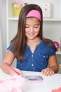 Beautiful young girl drawing a picture Royalty Free Stock Photo