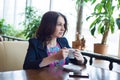 Beautiful young girl drinking coffee