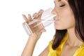 Beautiful young girl drinks water from glass Royalty Free Stock Photo