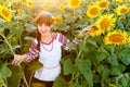 Beautiful young girl in embrodery a sunflower plant Royalty Free Stock Photo