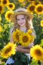 Beautiful young on the field of sunflowers Royalty Free Stock Photo
