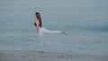 Beautiful girl exercising on the sandy beach Royalty Free Stock Photo