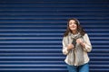 Beautiful girl listens music with blue background Royalty Free Stock Photo