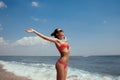 Beautiful young girl flying with seagulls on the sea