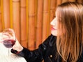 Beautiful young girl with glass of red wine Royalty Free Stock Photo