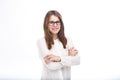 Beautiful young girl in glasses with black frame, with brown hair over shoulders and white shirt on white isolated background. Royalty Free Stock Photo