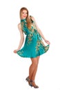 Beautiful young girl in a green dress dancing. Royalty Free Stock Photo