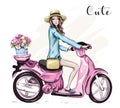 Beautiful young girl in hat with cute pink scooter.