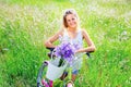 Beautiful young girl with her cruiser bike Royalty Free Stock Photo