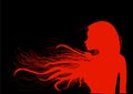 Beautiful young girl with her hair in bright red, on a black background. Royalty Free Stock Photo