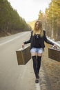 Beautiful young girl hitchhiking