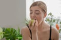 Beautiful young girl holding an apple in her hands. Vegetables and fruits Royalty Free Stock Photo