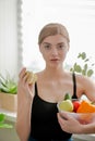 Beautiful young girl holding an apple in her hands. Vegetables and fruits Royalty Free Stock Photo