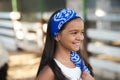 Beautiful young girl and horses in stall Royalty Free Stock Photo