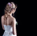 Beautiful young girl in the image of the bride, beautiful wedding hairstyle