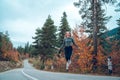 Beautiful young girl jumping for joy on the road in Svaneti Royalty Free Stock Photo