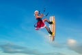 Beautiful young girl on the kite in the costume of Santa Claus. Royalty Free Stock Photo