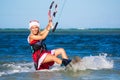 Beautiful young girl on the kite in the costume of Santa Claus. Royalty Free Stock Photo