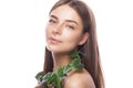 Beautiful young girl with a light natural make-up and perfect skin with Green branch in her hand . Beauty face. Royalty Free Stock Photo