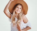 Beautiful young girl with long blond hair and blue eyes in a hat, closeup portrait Royalty Free Stock Photo