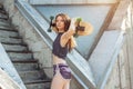 Beautiful young girl with a long board in the city. The concept of modern youth. Active fun holiday. Royalty Free Stock Photo