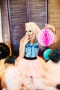 Beautiful young girl with long curly blond hair. A girl in an airy tutu Royalty Free Stock Photo