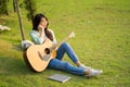 The beautiful young girl long hair sit on the field vacant look Royalty Free Stock Photo