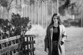 Beautiful young girl looking at the camera outdoors. Black and white photo Royalty Free Stock Photo