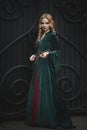 Beautiful young girl in the medieval dress holds a key Royalty Free Stock Photo