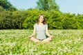 Beautiful young girl meditating in autumn park Royalty Free Stock Photo