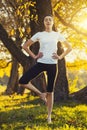 Beautiful young girl meditating in autumn park Royalty Free Stock Photo