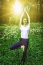 Beautiful young girl meditating in the forest Royalty Free Stock Photo