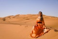 A girl in a beautiful Moroccan dress. Merzouga Morocco Royalty Free Stock Photo