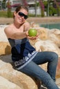 Beautiful young girl offering green apple Royalty Free Stock Photo