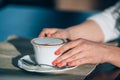 Beautiful young girl in outdoor cafe reading a Royalty Free Stock Photo