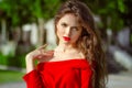 Beautiful young girl Outdoor portrait. Fashion brunette in red d Royalty Free Stock Photo