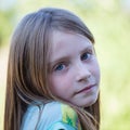 Beautiful young girl outdoors, portrait children close up Royalty Free Stock Photo