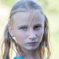 Beautiful young girl outdoors, portrait children close up Royalty Free Stock Photo