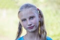 Beautiful young girl outdoors, portrait children close up Royalty Free Stock Photo