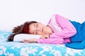 Beautiful young girl in pajamas calmly sleeping